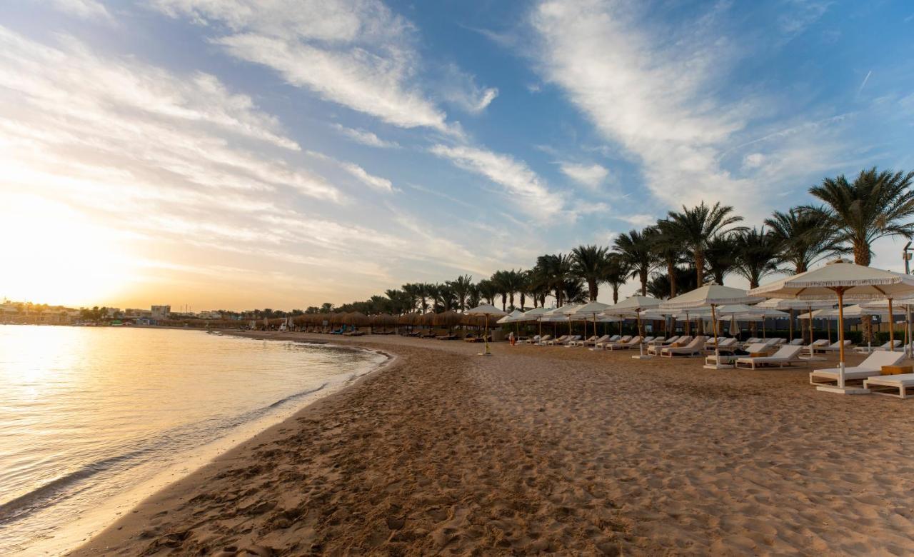 Sunrise Tucana Resort Grand Select 洪加達 外观 照片 Sunset at the beach of the Hilton Sharm El Sheikh Resort